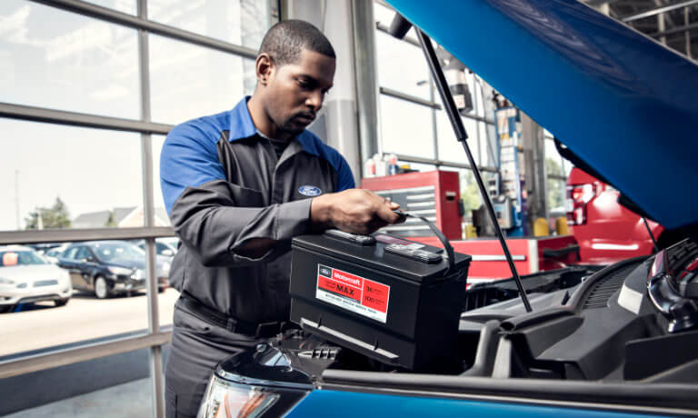 Ford technician changing a battery