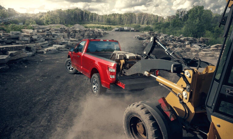 2023 Ford F-150 with rocks being loaded into bed