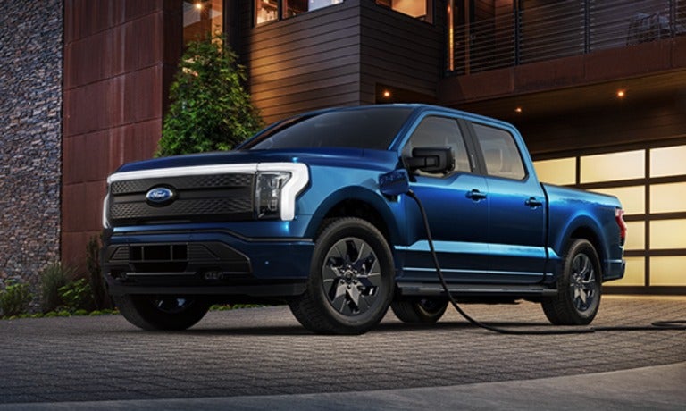 2023 Ford F-150 Lightning charging at a home