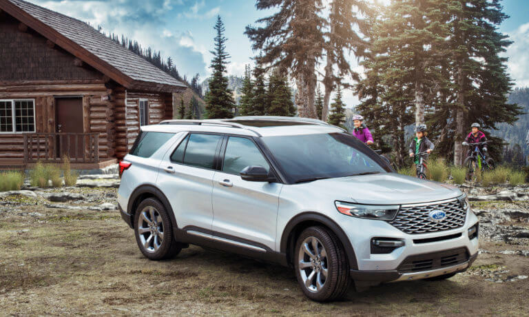 2024 Ford Explorer parked at a cabin with cyclists