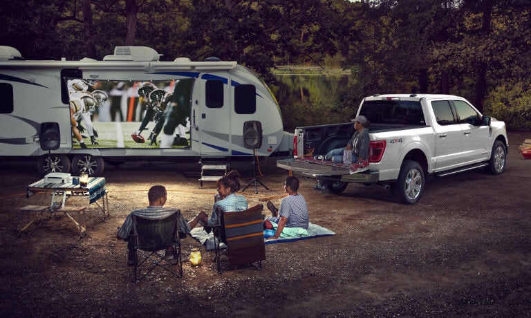2024 Ford F-150 with an RV in the forest