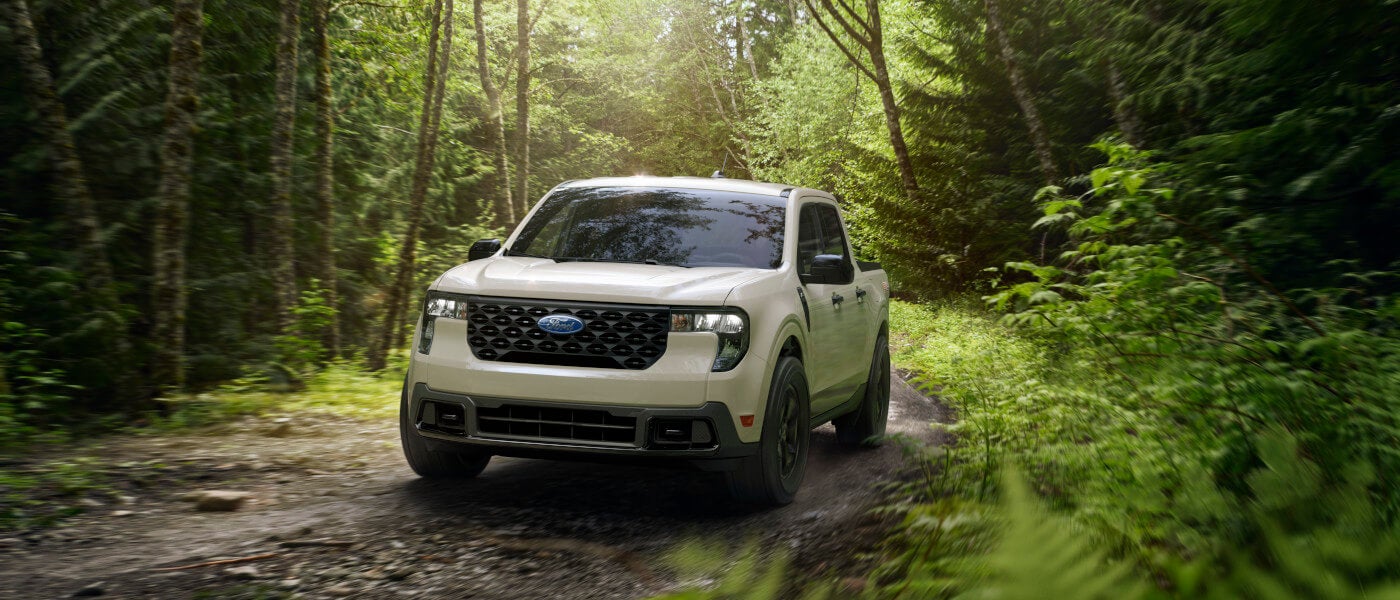 2025 Ford Maverick driving in a forest