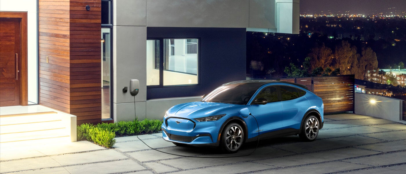 2025 Ford Mustang Mach-E charging on a driveway