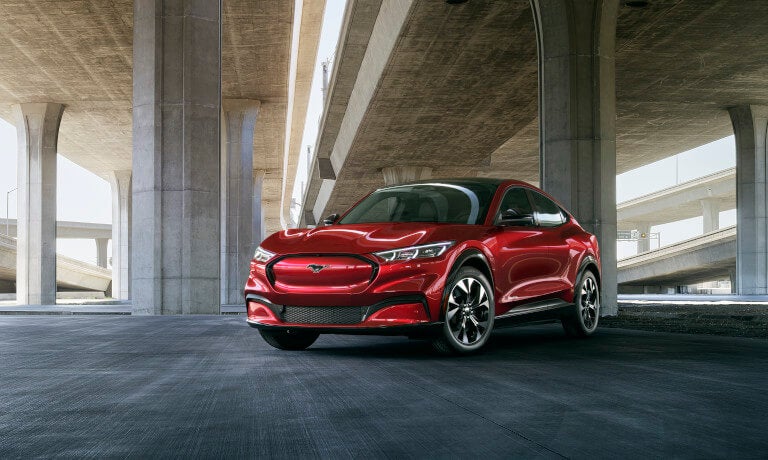 2025 Ford Mustang Mach-E parked beneath highway
